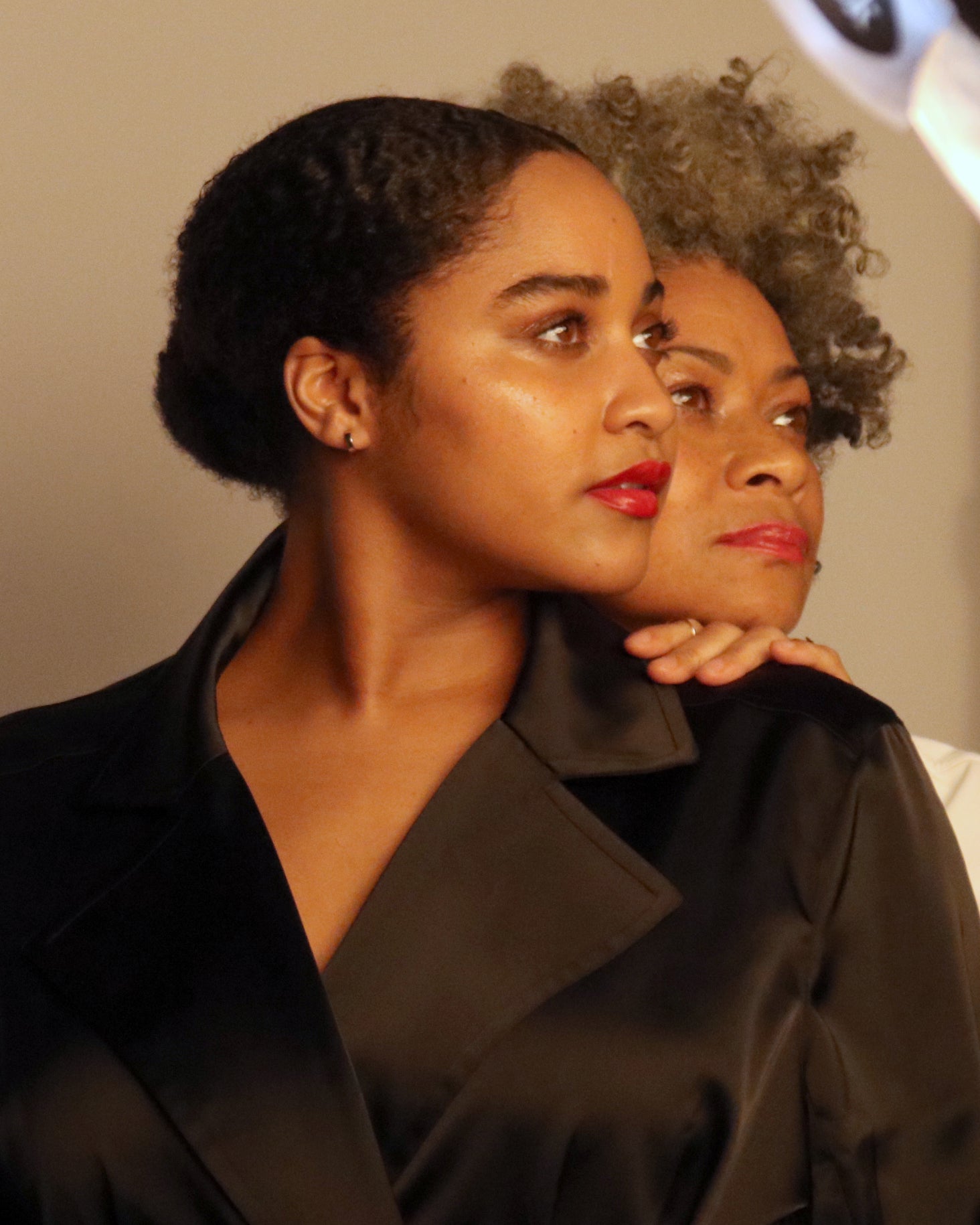 Mother and daughter side profile, red lipstick