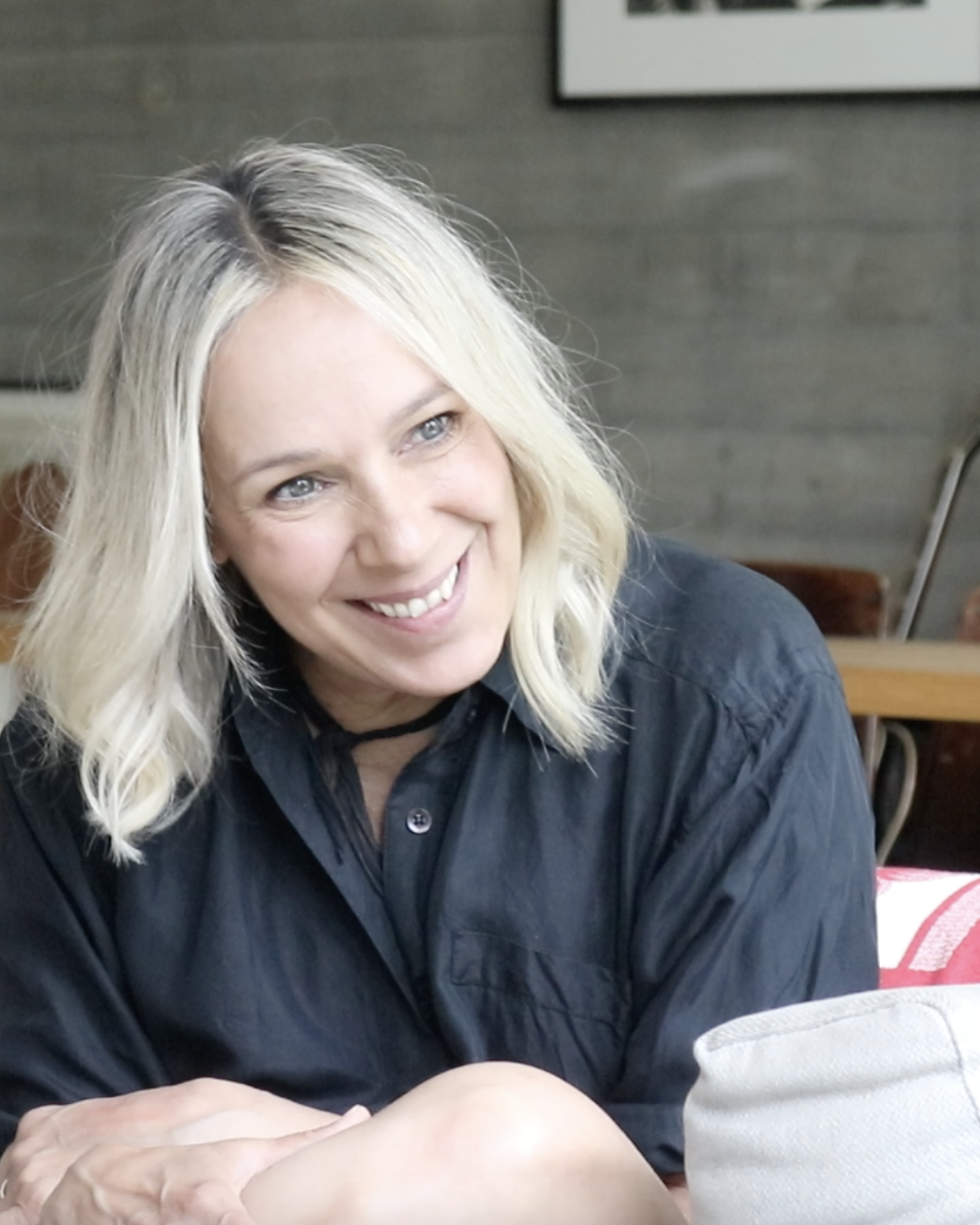 Woman sitting, smiling